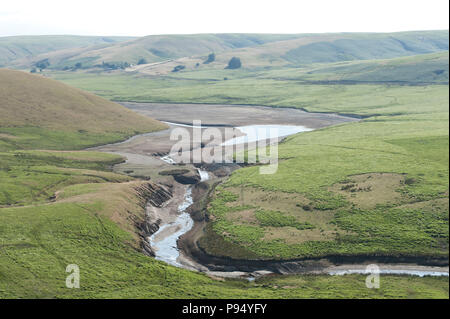 Rhayader, Powys, UK. 14th, July, 2018. Craig Goch reservoir, one the complex of reservoirs in the Elan Valley, near Rhayader in Powys, Wales, UK. is looking very dry. The Elan Valley reservoirs supply Birmingham with water. © Graham M. Lawrence/Alamy Live News Stock Photo