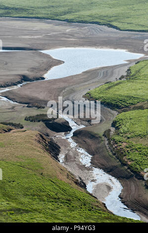 Rhayader, Powys, UK. 14th, July, 2018. Craig Goch reservoir, one the complex of reservoirs in the Elan Valley, near Rhayader in Powys, Wales, UK. is looking very dry. The Elan Valley reservoirs supply Birmingham with water. © Graham M. Lawrence/Alamy Live News Stock Photo