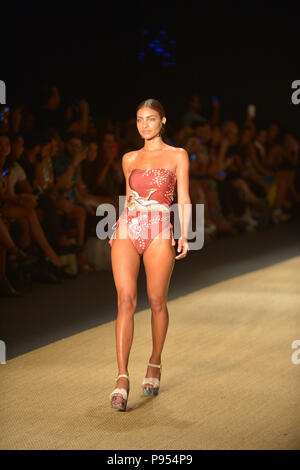 Miami Beach, FL, USA. 13th July, 2018. A model walks the runway for Agua Bendita show during the Paraiso Fashion Fair at The Paraiso Tent on July 13, 2018 in Miami Beach, Florida. Credit: Mpi10/Media Punch/Alamy Live News Stock Photo