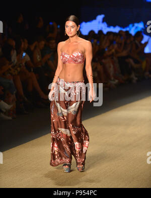 Miami Beach, FL, USA. 13th July, 2018. A model walks the runway for Agua Bendita show during the Paraiso Fashion Fair at The Paraiso Tent on July 13, 2018 in Miami Beach, Florida. Credit: Mpi10/Media Punch/Alamy Live News Stock Photo