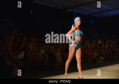 Miami Beach, FL, USA. 13th July, 2018. A model walks the runway for Agua Bendita show during the Paraiso Fashion Fair at The Paraiso Tent on July 13, 2018 in Miami Beach, Florida. Credit: Mpi10/Media Punch/Alamy Live News Stock Photo