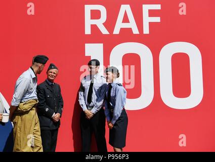 Beijing, Britain. 8th July, 2018. People in British Royal Air Force uniforms talk with each other at RAF100 (Royal Air Force 100th Anniversary) Aircraft Tour in London, Britain, on July 8, 2018. Credit: Guo Qiuda/Xinhua/Alamy Live News Stock Photo