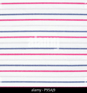 White fabric texture with red and blue stripes pattern. Closeup Stock Photo