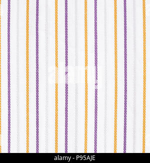 White fabric texture with orange and violet stripes pattern. Closeup Stock Photo