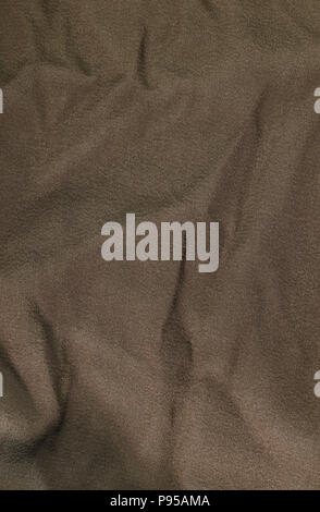 Brown wrinkled fabric texture. Closeup Stock Photo