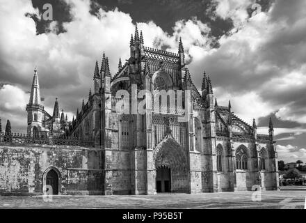 Late gothic and manueline architecture of Batalha Monastery Portugal in black and white. Stock Photo