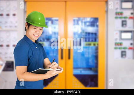Quality control concept with asian engineer or technician is working in factory Stock Photo