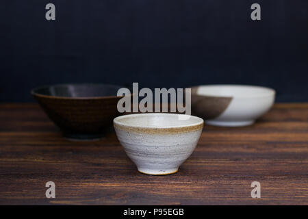Empty Japanese  ceramic bowl on wooden table. Stock Photo