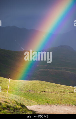 Beautiful Colorful rainbow over the Colorado Mountains Stock Photo