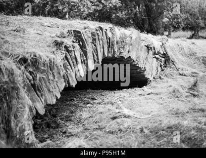 Old stone bridge uncovered by dry weather at Injebreck reservoir Stock Photo