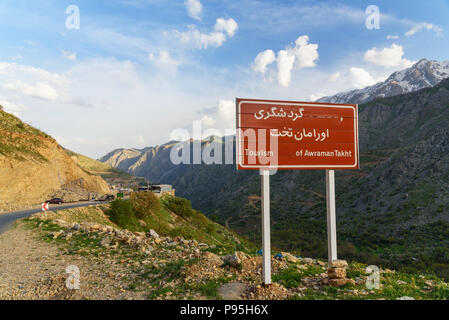 Howraman, Kurdistan Province, Iran - April 4, 2018:Sign at the entrance to Howraman village or Uraman Takht in Zagros Mountain Stock Photo