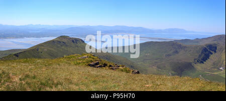 Summer view looking south towards Castlemaine Harbour and the Iveragh Peninsula from Caherconree on the Dingle Peninsula in County Kerry, Ireland Stock Photo