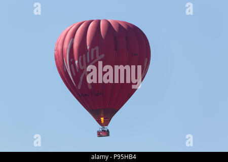 Hot air balloon in the sky over Rilla Mill in East Cornwall Stock Photo