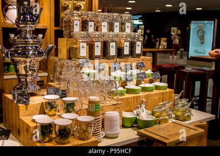 Large polished metal double tea kettle at a Herbal tea display at Marche restaurant, Zurich Airport Switzerland Stock Photo