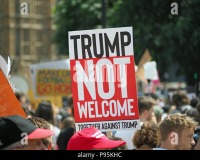 View of 'Trump Not Welcome' banners and placards waved by crowds at the anti Trump march in London on 13 July 2018 Stock Photo