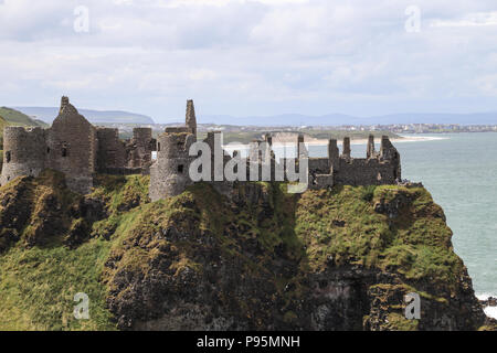 Dunluce Castle is a now-ruined medieval castle in Northern Ireland. It is located on the edge of a basalt outcropping in County Antrim. Stock Photo