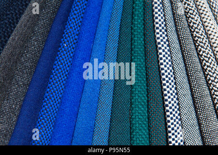 Wide range of colourful fabrics lay out side by side on display to differentiate the colours and details Stock Photo