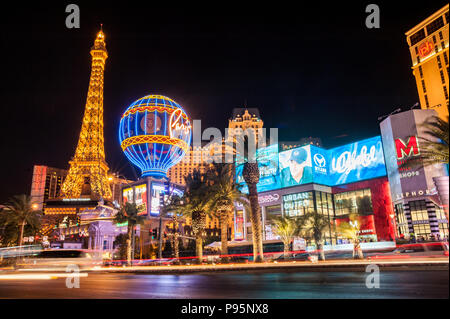 Las Vegas, Nevada, United States - May 27, 2013: Panorama night exposure of the neon light signs on the Las Vegas Strip and the Eiffel Tower. Stock Photo