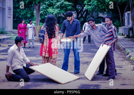 Operator holding clap board during the production of short film outdoor with actor. Stock Photo