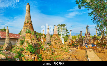 INLE LAKE, MYANMAR - FEBRUARY 18, 2018: Panorama of ancient stupas of Nyaung Ohak archaeological site, located on the hill of Inthein village, on Febr Stock Photo