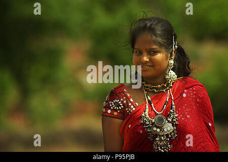 Young girl poses outside of her tribal village in india. Stock Photo