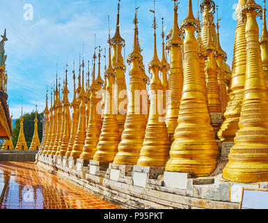 The unique architecture of Inn Thein Buddha image Shrine with numerous golden stupas on the hilltop of Indein village, Inle Lake, Myanmar. Stock Photo