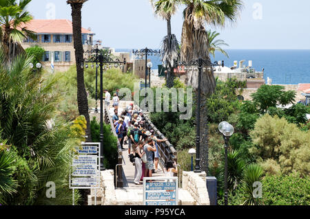 Group of tourists crossing the Wishing Bridge in Old Jaffa - Tel Aviv, Israel Stock Photo