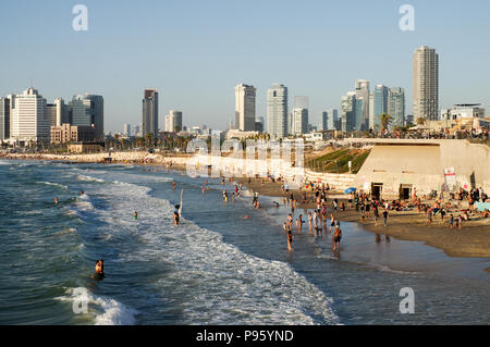 Beautiful Jaffa and Alma Beaches packed with people with Tel Aviv skyline in the background Stock Photo