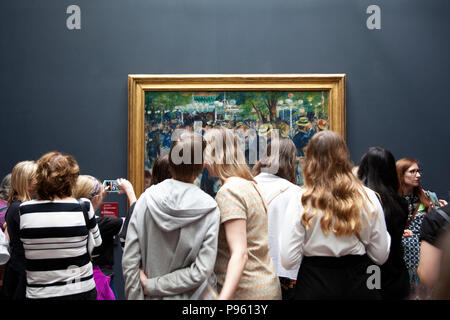 Crowds viewing 'Bal du moulin de la Galette' by Auguste Renoir at Musee D'Orsay in Paris, France Stock Photo