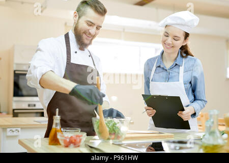 Smiling Chef Working in Restaurant Stock Photo