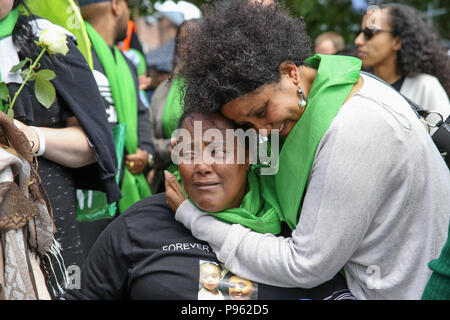 Members of family lay wreaths, flowers and lighting of candles at the base of Grenfell Tower outside Kensington Leisure Centre.  Featuring: Atmosphere, View Where: London, United Kingdom When: 14 Jun 2018 Credit: Dinendra Haria/WENN Stock Photo