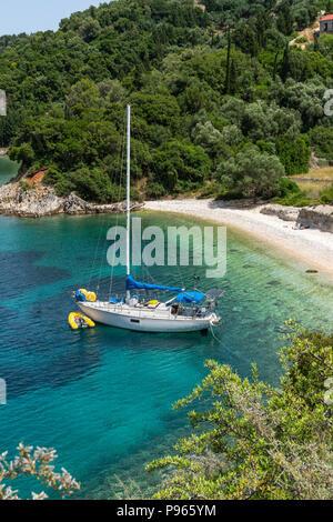 Yacht at anchor in one of the many small  coves near Kioni on the North East coast of the  island of Ithaca, Ionian Sea, Greece Stock Photo
