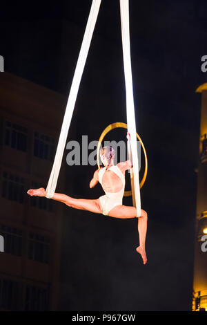 Bucharest, ROMANIA - July 14 2018: Beginning of the Sonics in Wish performance at Street Theater Festival. Aerial acrobatics performed on overturned s Stock Photo