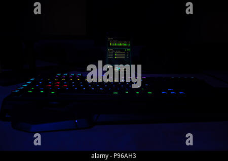 rgb lighted gaming keyboard with smartphone connection focus Stock Photo