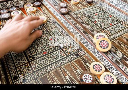 Checkers and dices on backgammon board game Stock Photo