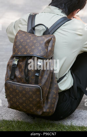 Man with Louis Vuitton bag in hand and Hermes belt on June 18, 2018 in  Milan, Italy Stock Photo