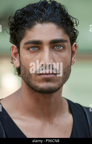 MILAN - JUNE 18: Man with blue eyes and black hair portrait before