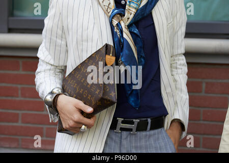 MILAN - JUNE 18: Man with Louis Vuitton bag in hand and Hermes belt before  Fendi fashion show, Milan Fashion Week street style on June 18, 2018 in Mil  Stock Photo - Alamy