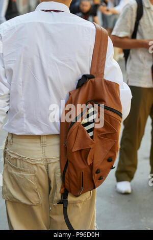 Man with Louis Vuitton bag in hand and Hermes belt on June 18, 2018 in  Milan, Italy Stock Photo