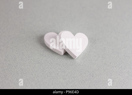 two wooden hearts on craft background Stock Photo