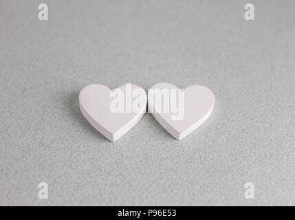 two wooden hearts on craft background Stock Photo