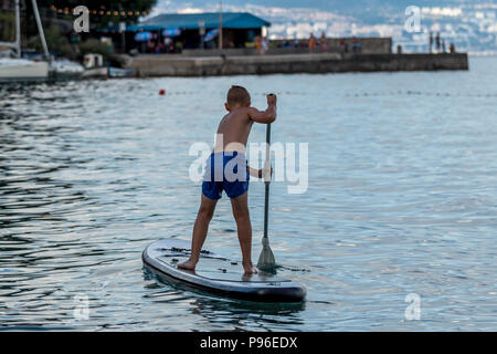 stand up paddle boarding on the sea Stock Photo