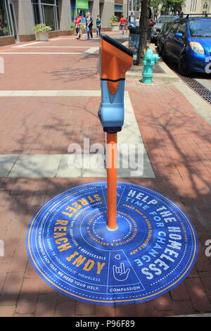 Time for change, help the homeless, repurposed parking meter mounted at the Monument Circle in downtown Indianapolis, Indiana. Stock Photo