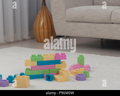 Living room interior with toy bricks on the floor carpet Stock Photo