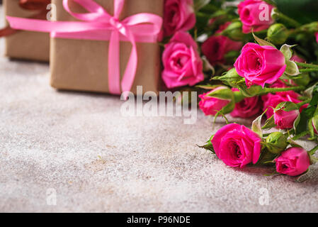 gift box with ribbons and beautiful roses inside, isolated on a white ...