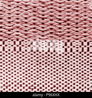 Red hand weaving matting tweed fabric texture. Closeup square fragment Stock Photo