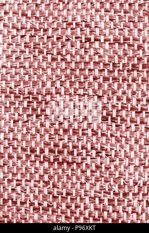 Red hand weaving matting tweed fabric texture. Closeup vertical fragment Stock Photo
