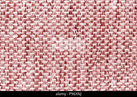 Red hand weaving matting tweed fabric texture. Closeup horizontal fragment Stock Photo