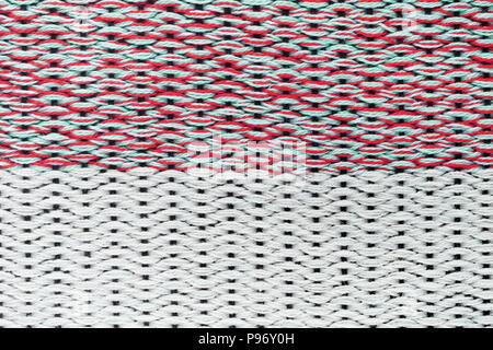 Red hand weaving matting tweed fabric texture. Closeup horizontal fragment Stock Photo