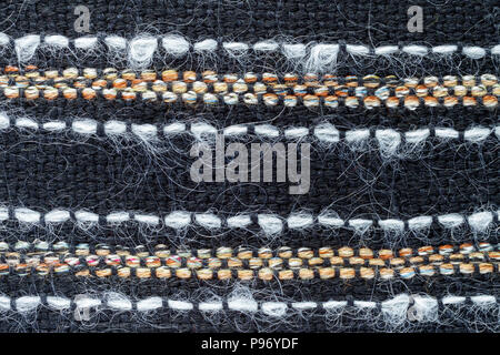 Red hand weaving matting tweed fabric texture. Closeup horizontal fragment Stock Photo